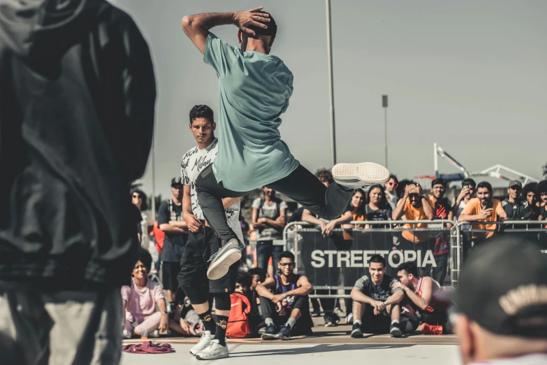 a man flying through the air while riding a skateboard, pexels contest winner, graffiti, rapping on stage at festival, males and females breakdancing, looking across the shoulder, 15081959 21121991 01012000 4k