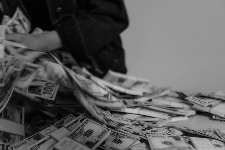 a pile of money sitting on top of a table, a black and white photo, by Matija Jama, pexels contest winner, dollar bills body horror, performing, taejune kim, hunting