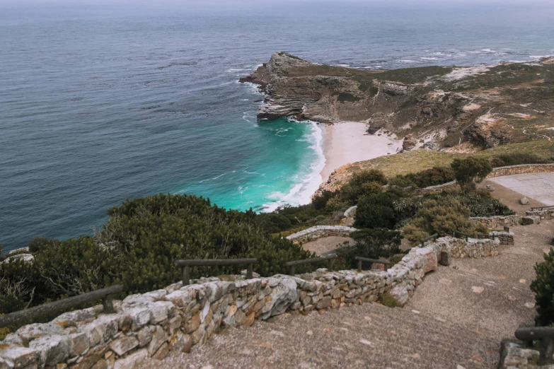 a view of a beach from the top of a hill, pexels contest winner, south african coast, 2 5 6 x 2 5 6 pixels, high cliff, steps leading down