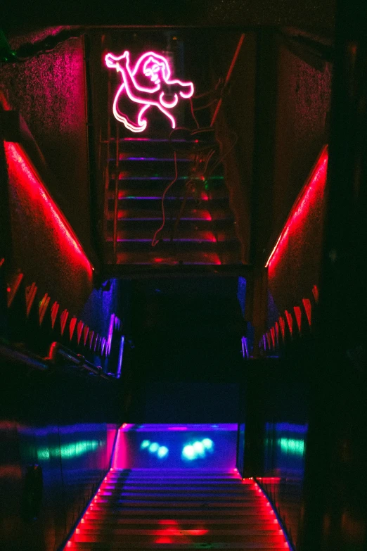 a set of stairs leading up to a neon sign, an album cover, unsplash, decorations, red neon eyes, dance club rave, spooky photo