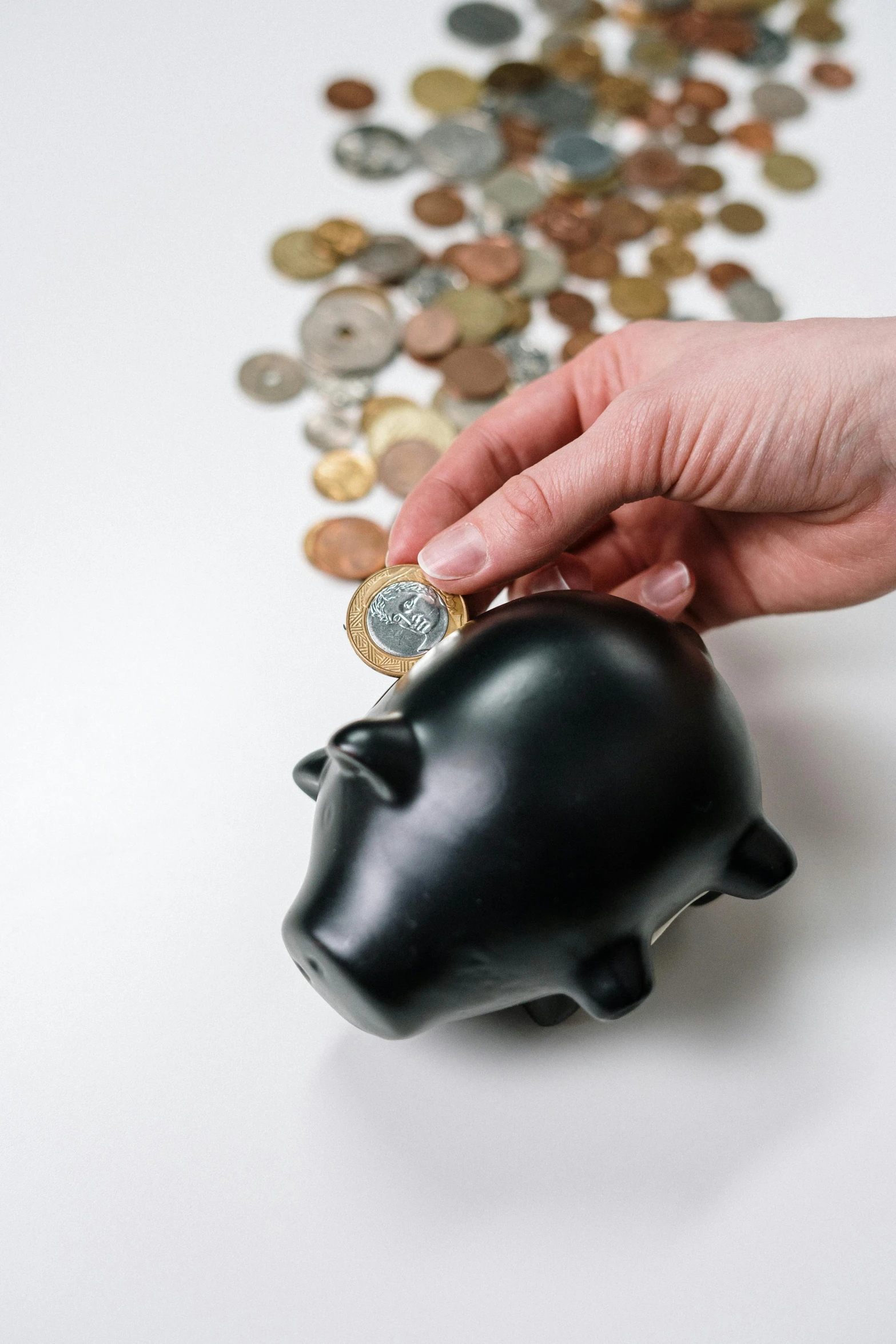 a person putting a coin into a piggy bank, by Matt Cavotta, pexels, renaissance, or black, 15081959 21121991 01012000 4k, high key, instagram photo