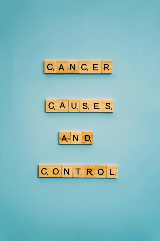 the words cancer cause and control spelled in scrabbles on a blue background, pixabay, vintage color, thumbnail, teal color graded, may)