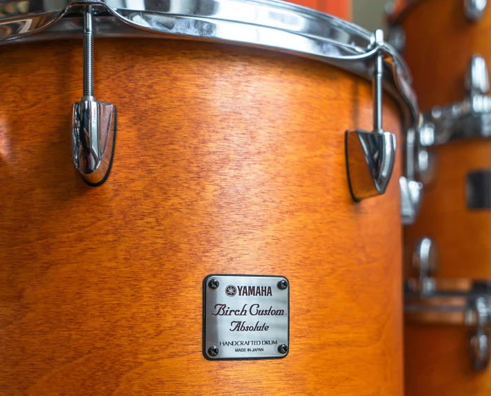 a close up of a pair of drums, caramel, japanese collection product, thumbnail, burnt sienna