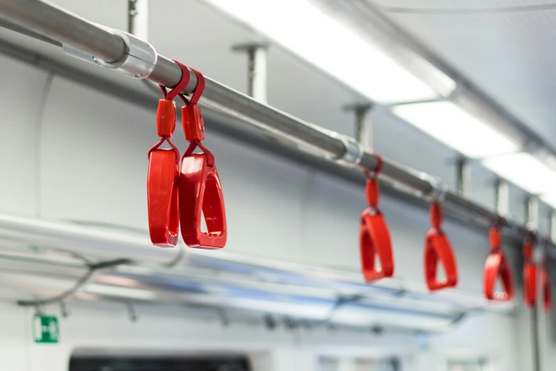 a bunch of red bags hanging from the ceiling, unsplash, high speed trains, harnesses, 3 d print, 🦑 design