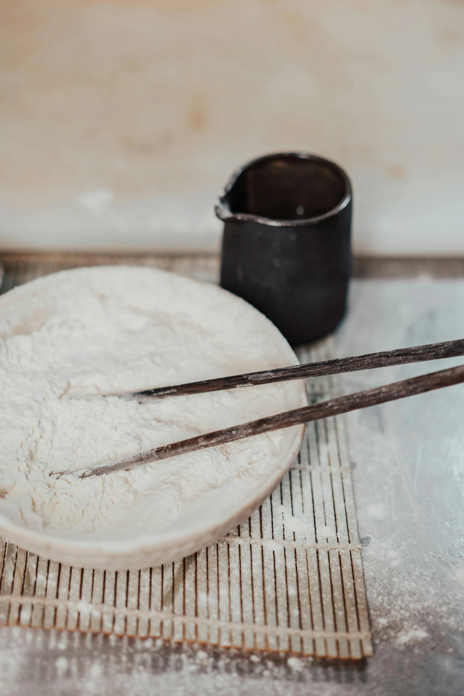 a bowl of flour and chopsticks on a mat, trending on unsplash, process art, working in the forge, breads, made of glazed, instagram story