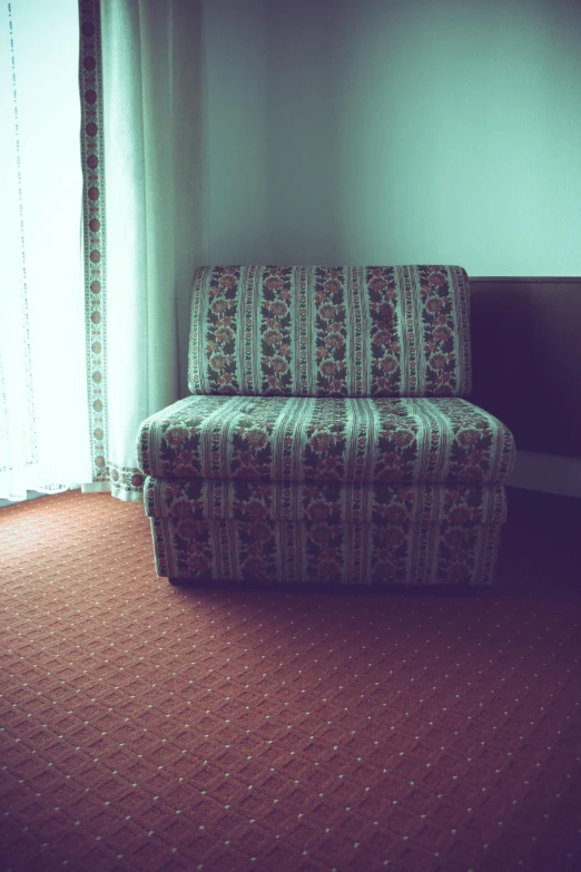 a chair sitting in a living room next to a window, an album cover, inspired by Elsa Bleda, hotel room, old moist carpet, 90's photo, slightly pixelated