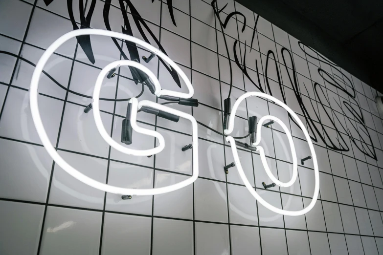 a close up of a neon sign on a wall, trending on cg society, gq magazine, white neon, no logo, goop