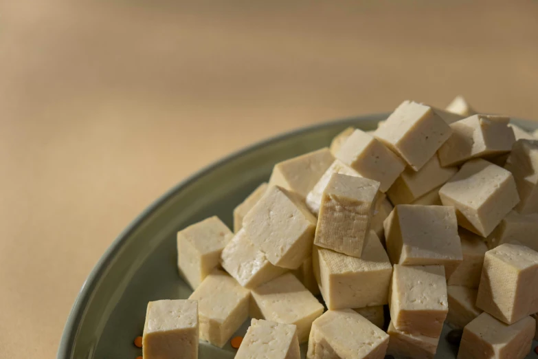 a plate of tofu sitting on a table, detailed product image, fan favorite, vanilla, 8mm