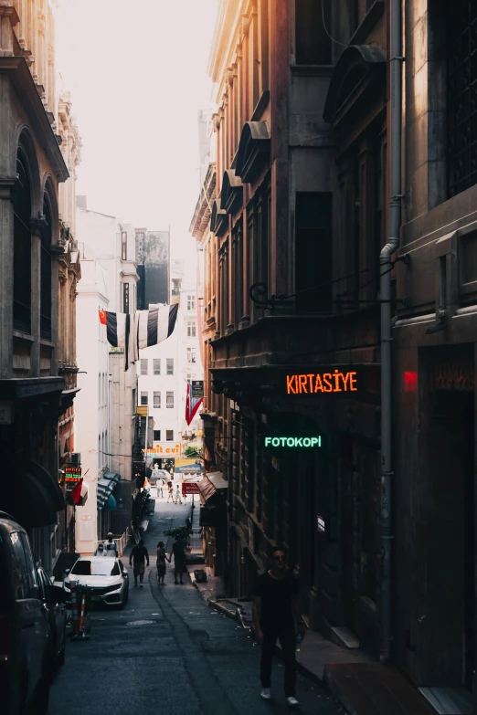 a city street filled with lots of tall buildings, a picture, pexels contest winner, renaissance, turkey, bright signage, vsco, shady alleys