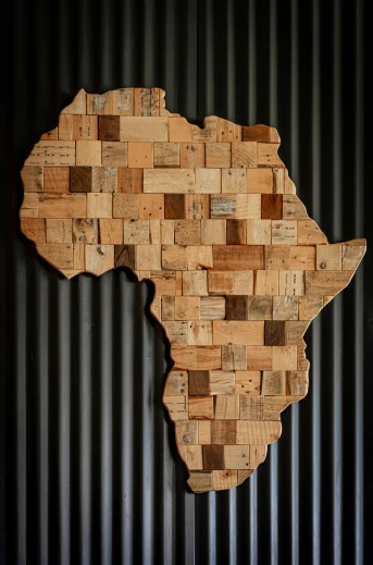 a piece of wood with a map of africa on it, inspired by Afewerk Tekle, ecological art, wine, overlooking, 2019 trending photo, multiple stories