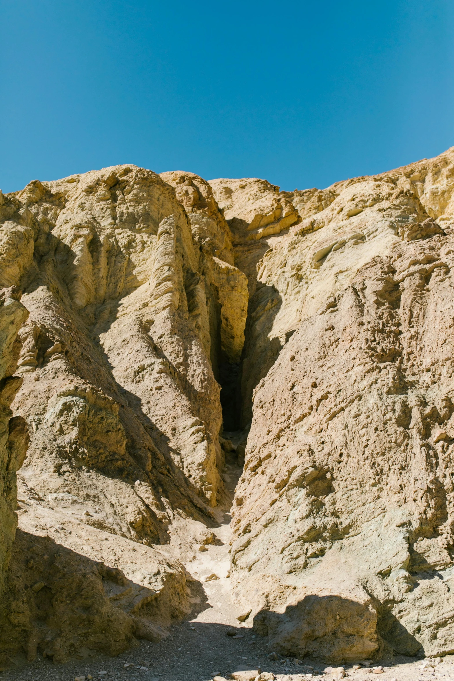 a large rock formation in the middle of a desert, by Doug Ohlson, les nabis, colorful ravine, death valley, ocher details, panoramic shot