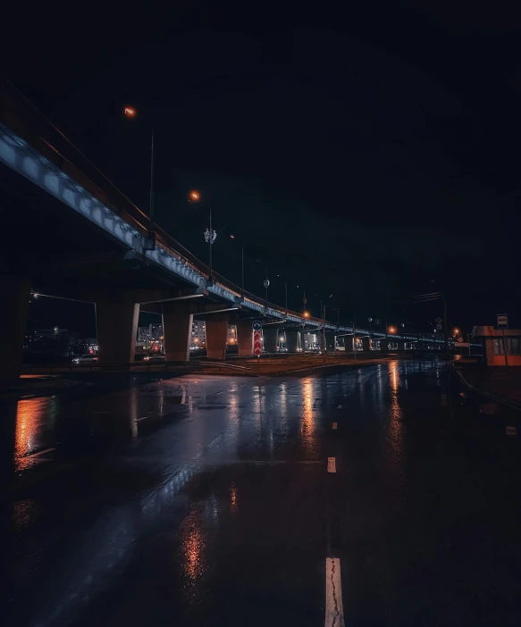 a bridge over a body of water at night, an album cover, inspired by Elsa Bleda, unsplash contest winner, postminimalism, reflections on wet streets, freeway, today\'s featured photograph 4k, dark futuristic