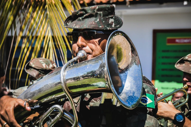 a group of men in uniform playing musical instruments, by Felipe Seade, pexels contest winner, hurufiyya, brasil, avatar image, camouflaged gear, 🚿🗝📝