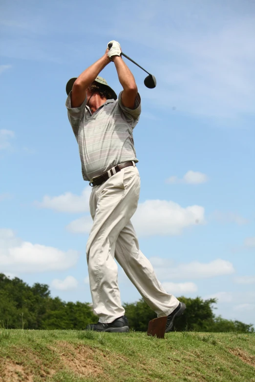 a man swinging a golf club on a sunny day, by Daren Bader, very sweaty, jim cramer, colombian, soaring