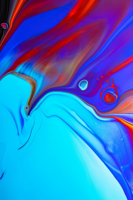 a close up of a cell phone on a table, a microscopic photo, by Tony Szczudlo, trending on pexels, abstract art, fluid acrylic pour art, blue and red, rainbow liquids, earth