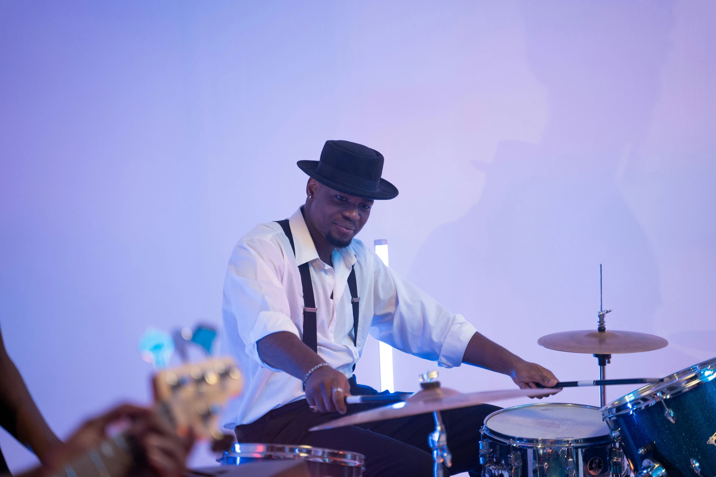 a man sitting in front of a drum set, profile image, wedding, adebanji alade, playing drums