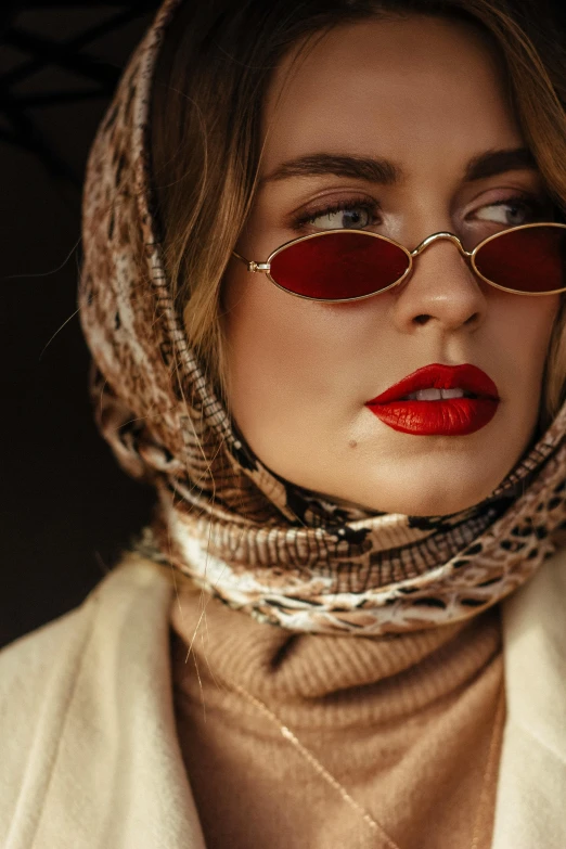 a woman wearing sunglasses and a scarf, inspired by Hedi Xandt, trending on pexels, photorealism, gold and red, muslim, pout, woman in streetwear