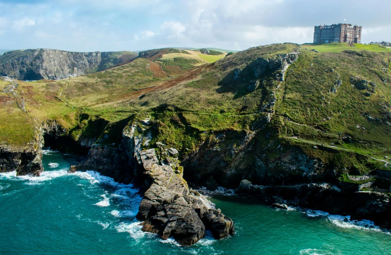 a large body of water next to a lush green hillside, pexels contest winner, renaissance, cornwall, photo of penelope cruz, king arthur's court, thumbnail