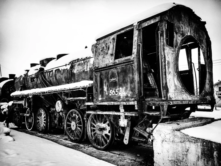 a black and white photo of an old train, by Kristian Zahrtmann, auto-destructive art, frozen and covered in ice, zdislav beksinsk - h768, photographic print, full width