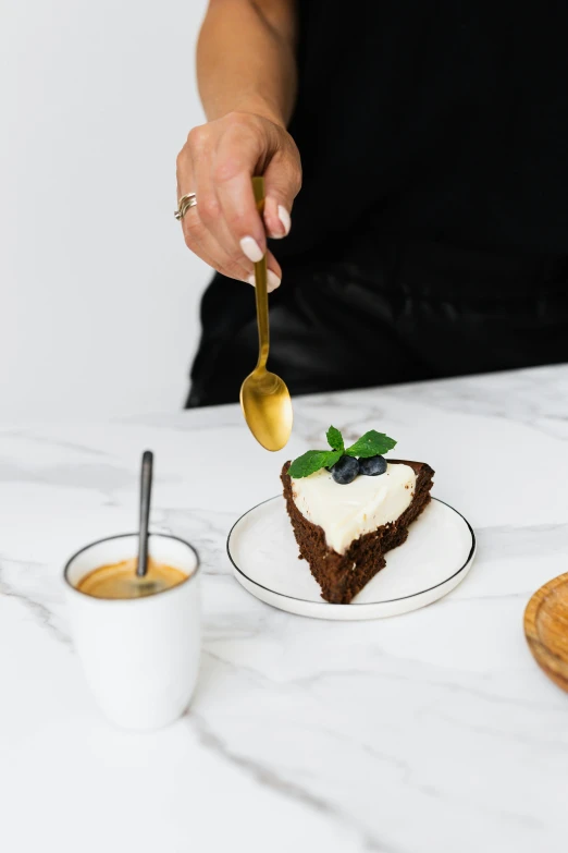 a person holding a spoon over a piece of cake, profile image, celebration of coffee products, hammershøi, medium height