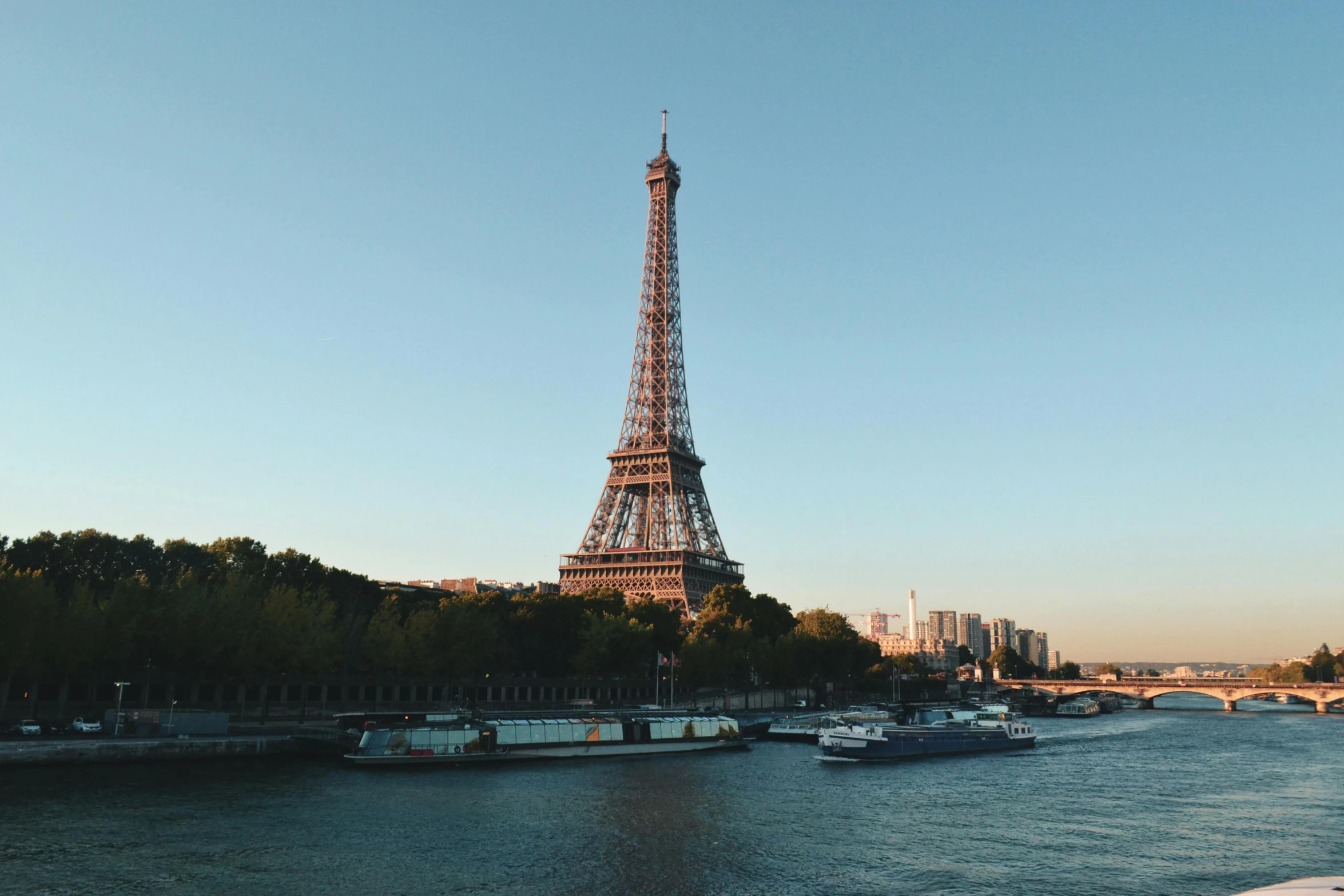 a view of the eiffel tower from across the river, pexels contest winner, full daylight, 8k resolution”, tall thin, ad image