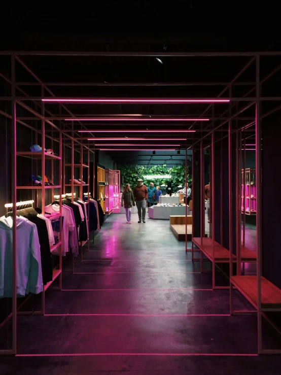 the inside of a clothing store with pink lighting, a digital rendering, by Jan Tengnagel, trending on unsplash, black show room, walking down, high quality photo, thumbnail