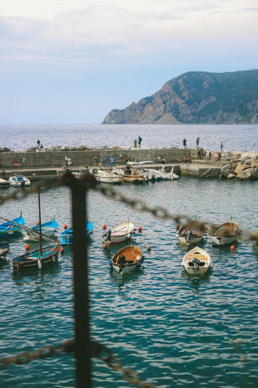 a group of boats floating on top of a body of water, by Carlo Carrà, pexels contest winner, renaissance, 2 5 6 x 2 5 6 pixels, cinq terre, 35 mm photo, small dock