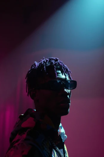 a man that is standing in front of a microphone, an album cover, trending on pexels, visual art, digital sunglasses, lowkey lighting, ( ( theatrical ) ), playboi carti portrait