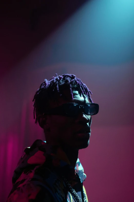 a man that is standing in front of a microphone, an album cover, trending on pexels, visual art, digital sunglasses, lowkey lighting, ( ( theatrical ) ), playboi carti portrait