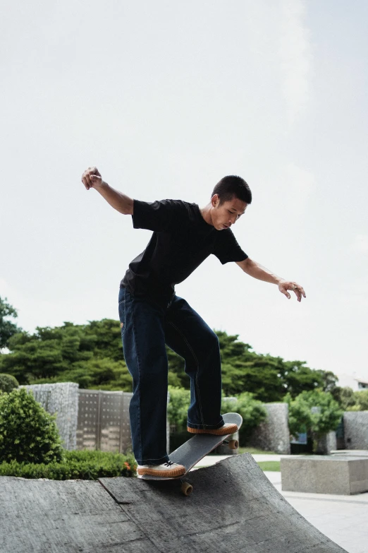 a man riding a skateboard up the side of a ramp, inspired by Fei Danxu, happening, man standing in defensive pose, at a park, lei jin, carving