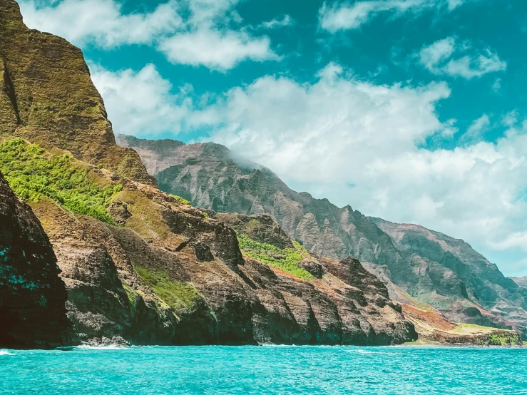 a body of water with mountains in the background, a photo, hawaii, cliffs, 8k resolution”, instagram post