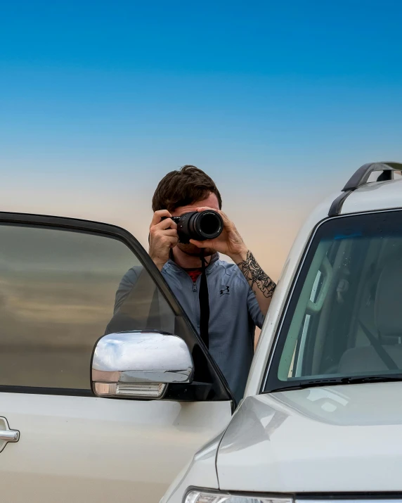 a man taking a picture of himself in a car, a picture, by Andrew Allan, unsplash contest winner, mid body shot, clear reflection, today\'s featured photograph 4k, telephoto vacation picture