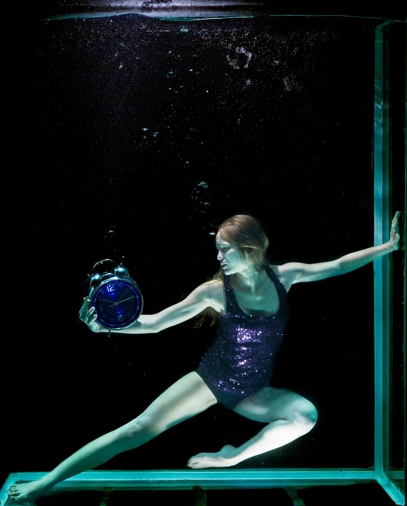 a woman in a purple leo leo leo leo leo leo leo leo leo leo leo leo leo, an album cover, by David Palumbo, unsplash, conceptual art, underwater bubbles, dark blue leotard costume, a huge glass tank, a woman holding an orb