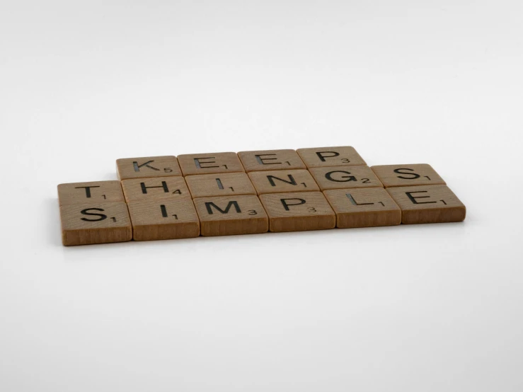 a scrabble that says keep things simple, by Joel Shapiro, conceptual art, detailed product shot, substance render, panels, brown