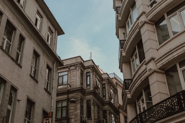 a couple of buildings that are next to each other, a photo, pexels contest winner, neoclassicism, fallout style istanbul, low angle camera view, background image, 1 2 9 7