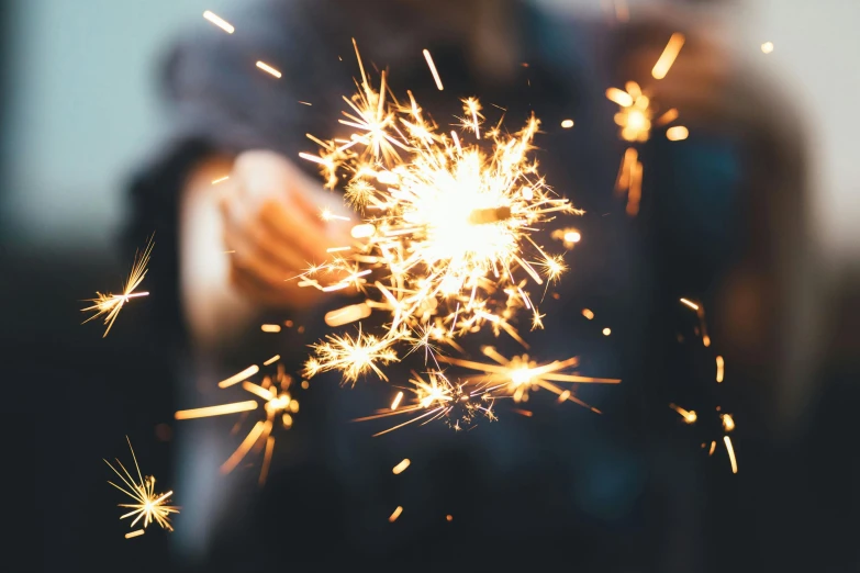 a person holding a sparkler in their hand, pexels contest winner, magnesium, thumbnail, celebrating a birthday, avatar image