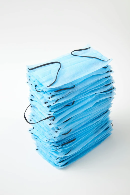 a stack of blue surgical masks on a white background, by Ryan Pancoast, slide show, 4 0 0 0 0 0, premium, construction