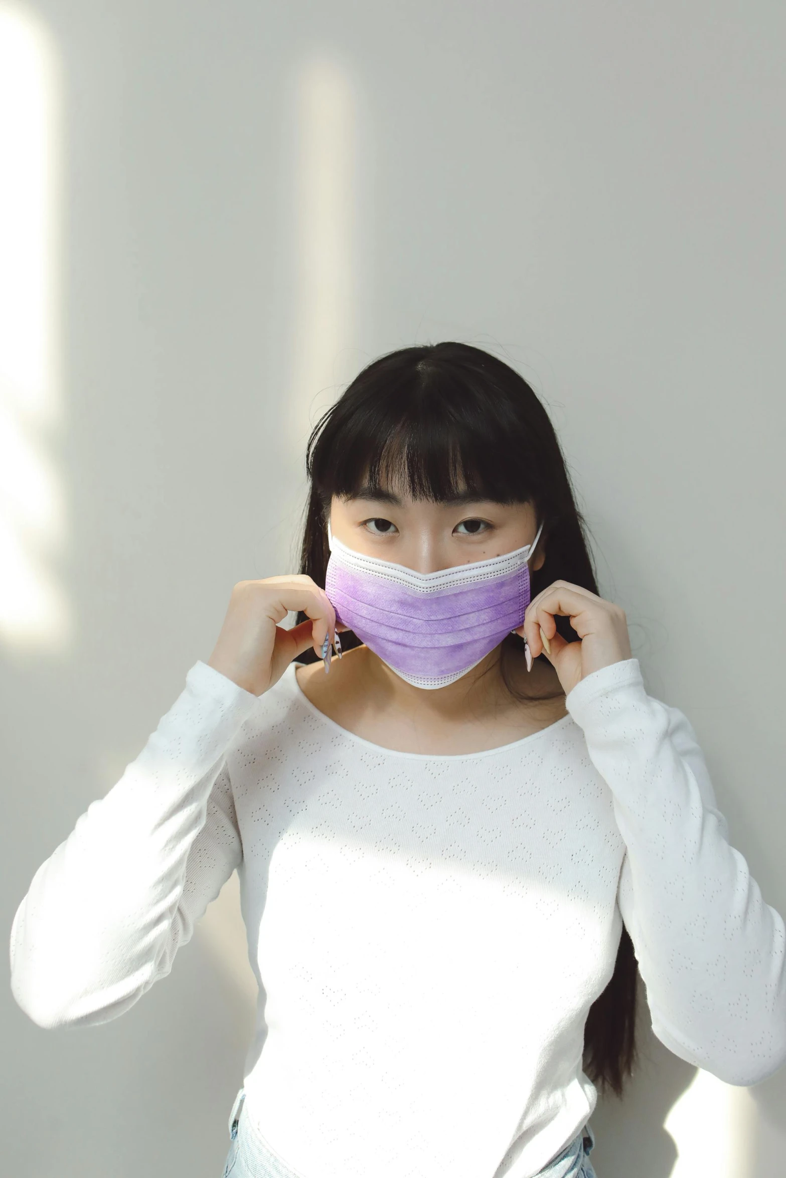 a woman in a white shirt and a purple mask, trending on pexels, shin hanga, wearing purple undershirt, soft volume absorbation, masked person in corner, from china