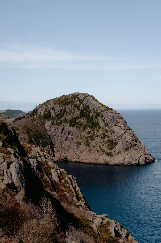 a large body of water next to a cliff, a photo, by David Simpson, les nabis, gauthier leblanc, slide show, piroca, hziulquoigmnzhah