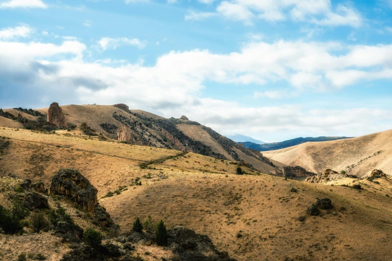 a view of the mountains from the top of a hill, by Peter Churcher, unsplash, oregon trail, canyon, background image