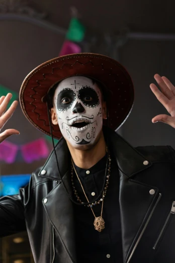 a man with a skeleton face painted on his face, trending on pexels, lowbrow, wearing sombrero, a man wearing a black jacket, promotional image, ( ( theatrical ) )