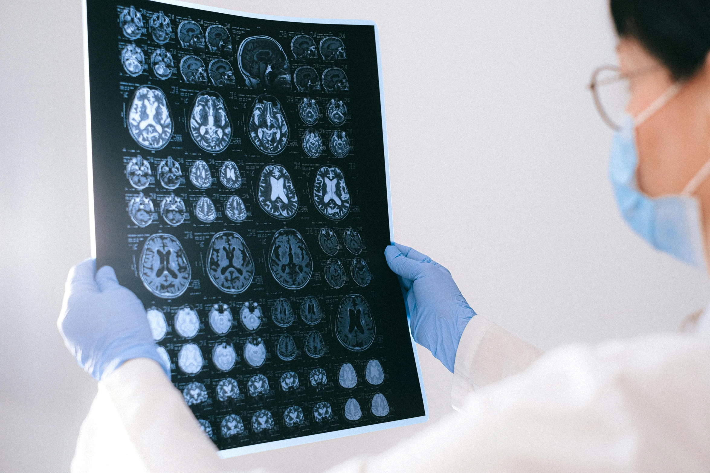 a close up of a person holding a piece of paper, medical imaging, grey matter, medical book, thumbnail