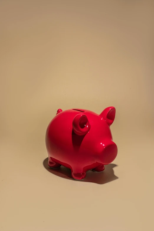 a red piggy bank sitting on top of a table, by Andries Stock, pexels contest winner, visual art, patricia piccinini, single color, satoshi, 15081959 21121991 01012000 4k