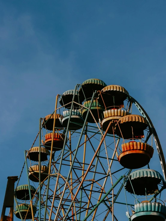 a ferris wheel against a blue sky with clouds, pexels contest winner, aestheticism, orange and teal color, thumbnail, vintage aesthetic, multiple stories