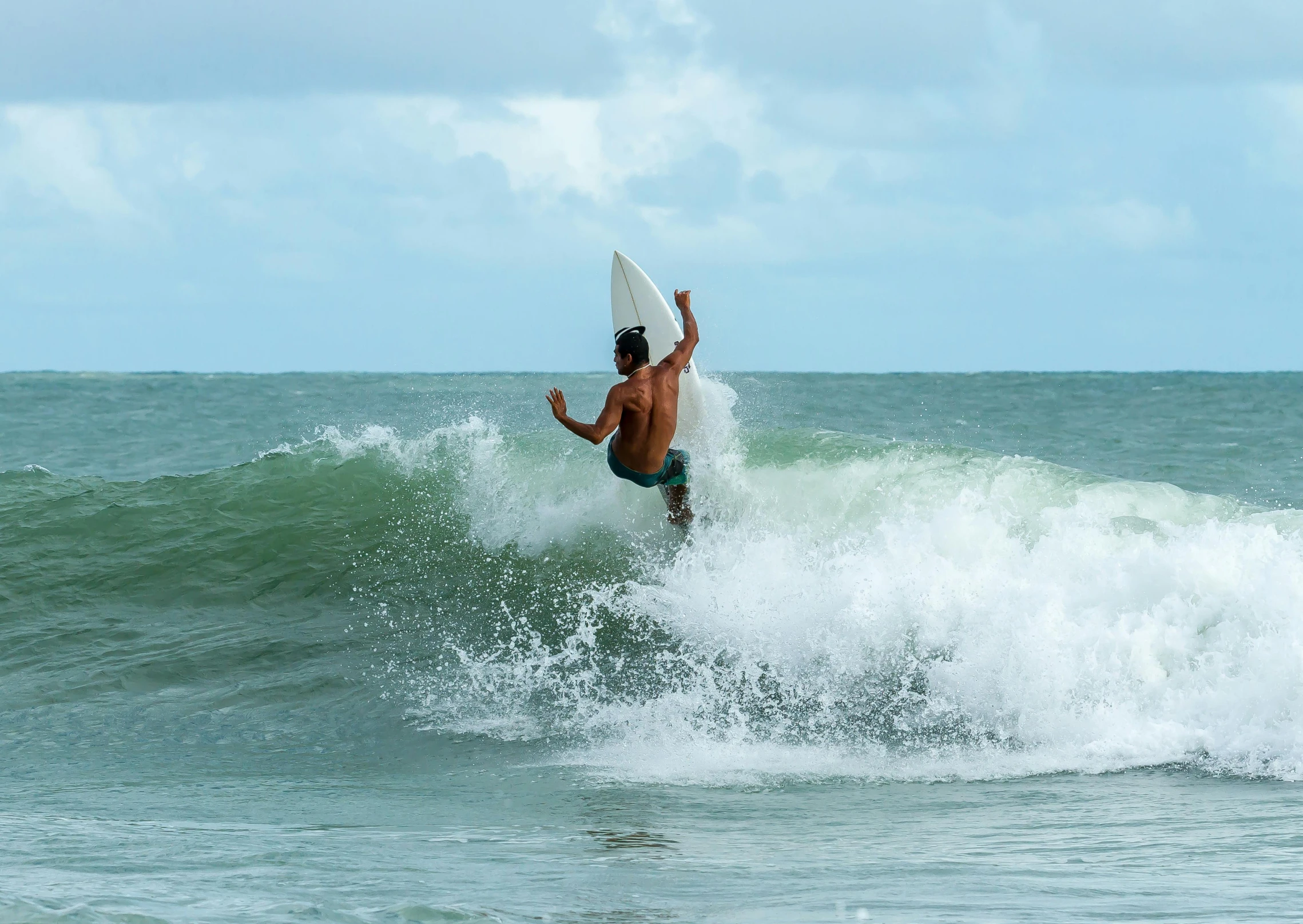 a man riding a wave on top of a surfboard, by Carey Morris, pexels contest winner, malaysian, thumbnail, 8k 4k, australian beach