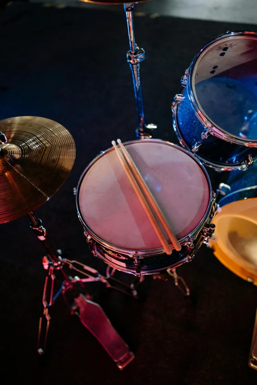 a close up of a drum set on a stage, by Dave Melvin, shutterstock, taken in 2 0 2 0, various colors, high angle close up shot, paul barson