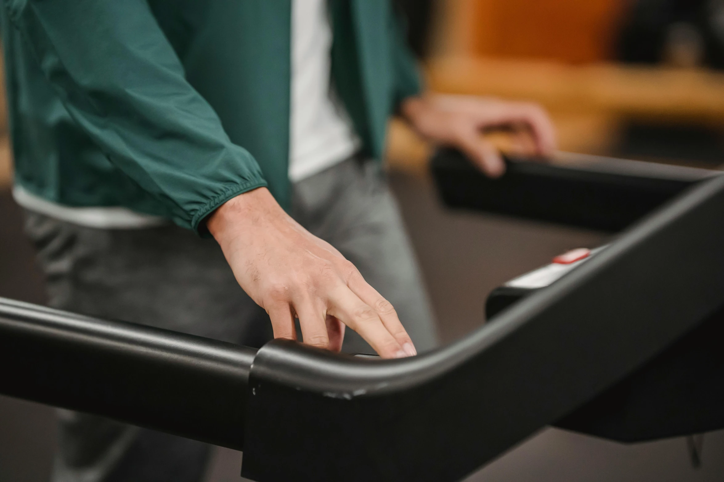 a close up of a person using a tread machine, trending on pexels, carrying a tray, pianist, traverse, back of hand on the table