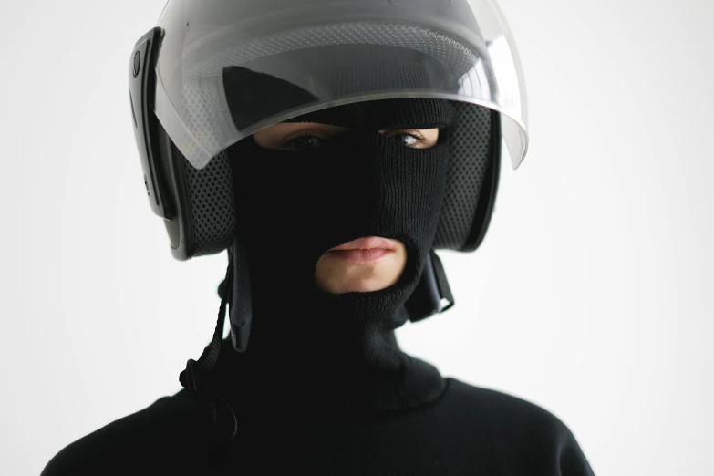 a close up of a person wearing a helmet, by Nina Hamnett, balaclava mask, outfit: cop, wearing turtleneck, full product shot