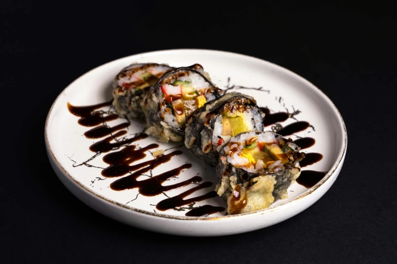 a white plate topped with sushi covered in sauce, elliot alderson, splatter, black, sougetsu