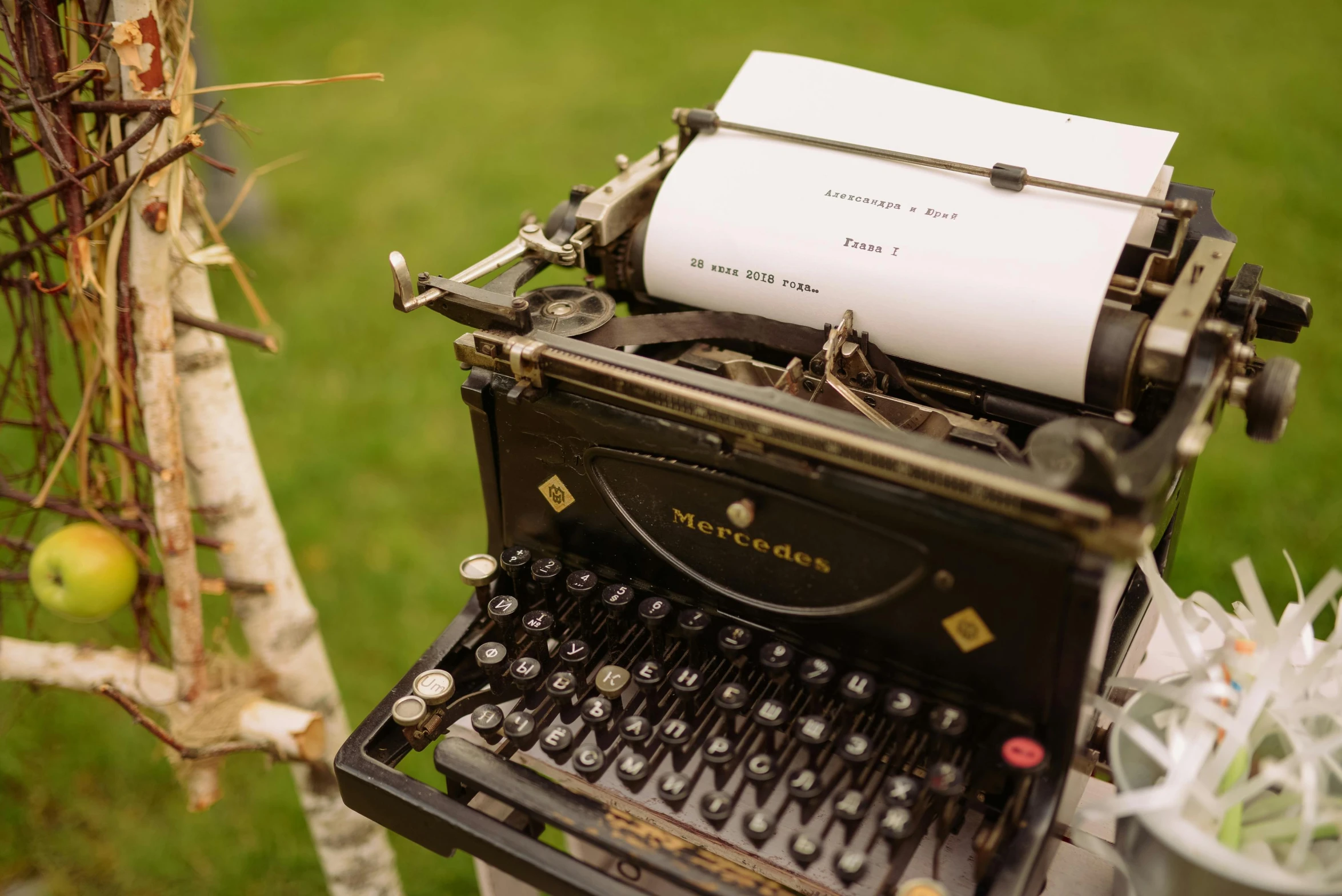 an old typewriter sitting on top of a table, by Romain brook, unsplash, private press, reading under a tree, wedding, 15081959 21121991 01012000 4k, high angle close up shot